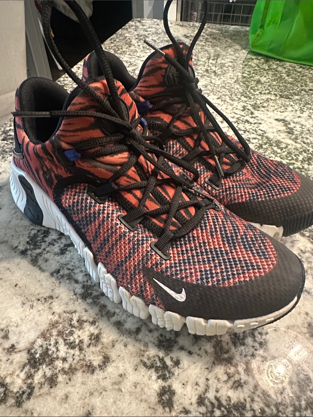 Nike women’s Orange and Black Knit Athletic Sneakers